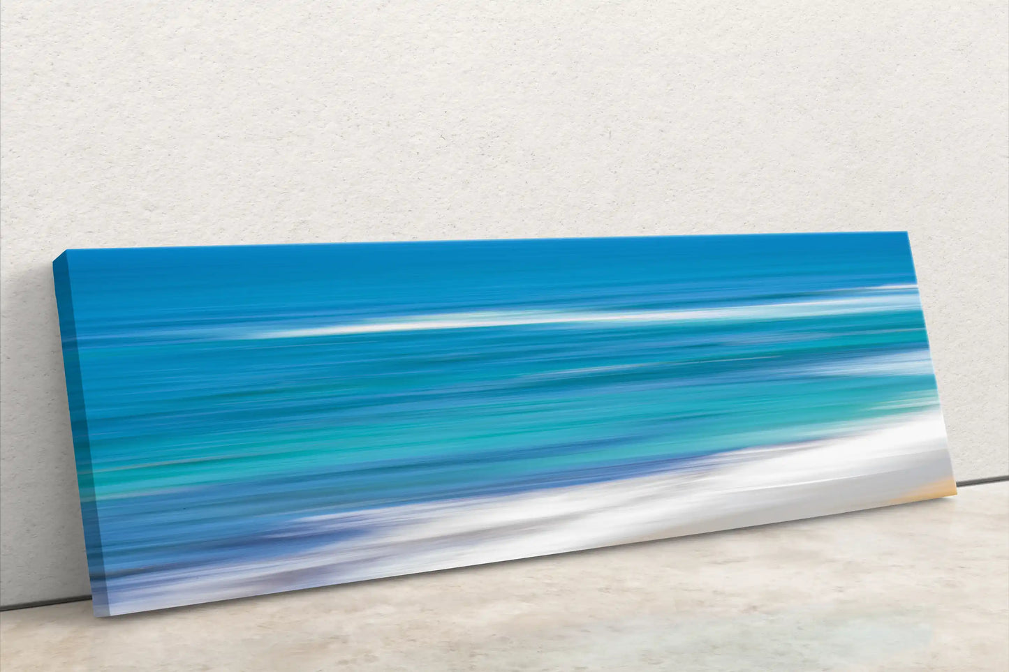Blue Ocean abstract panorama art on canvas leaning against wall