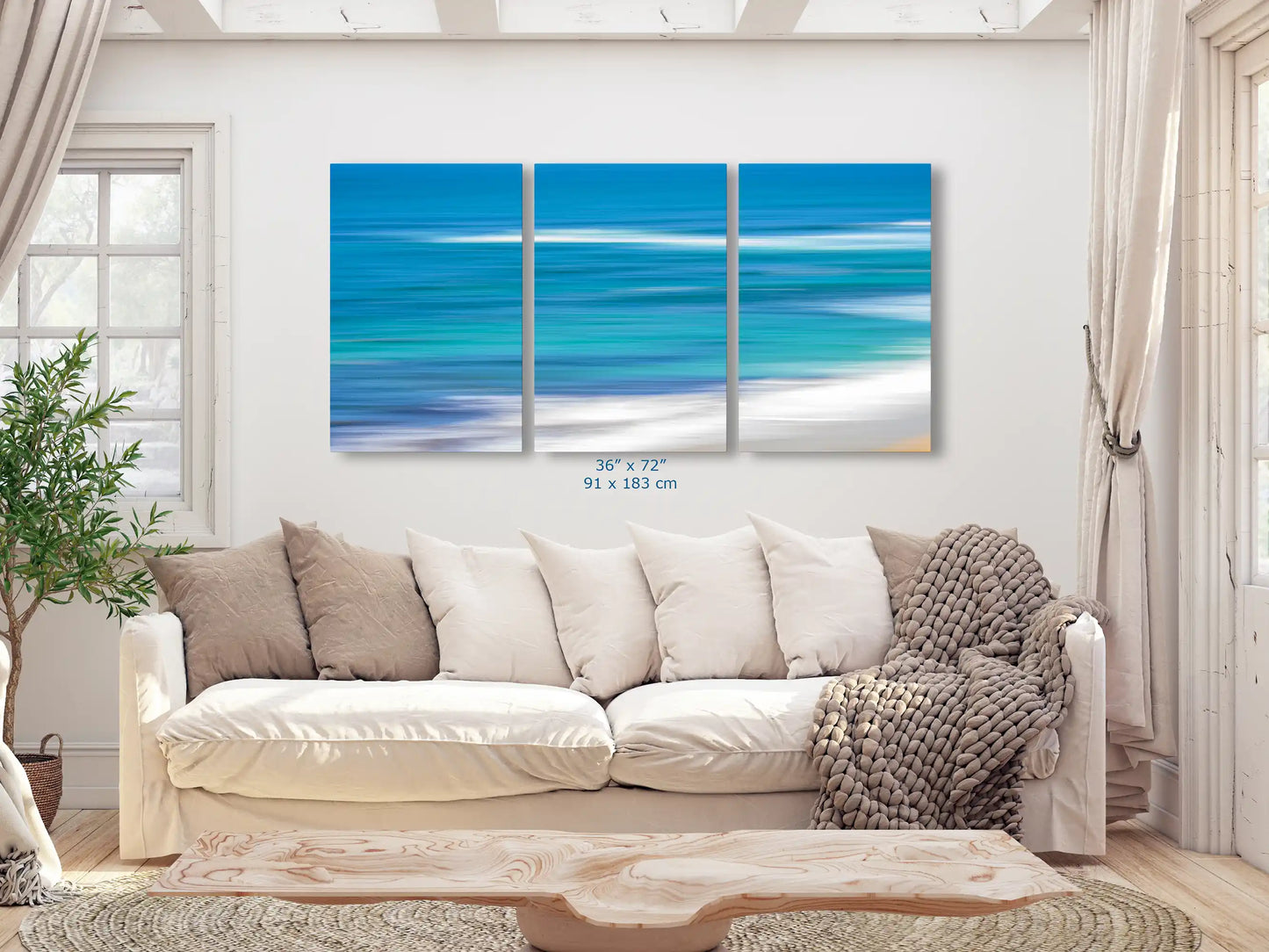 Blue Ocean abstract art in 3-piece canvas 36x72-inches over living room couch