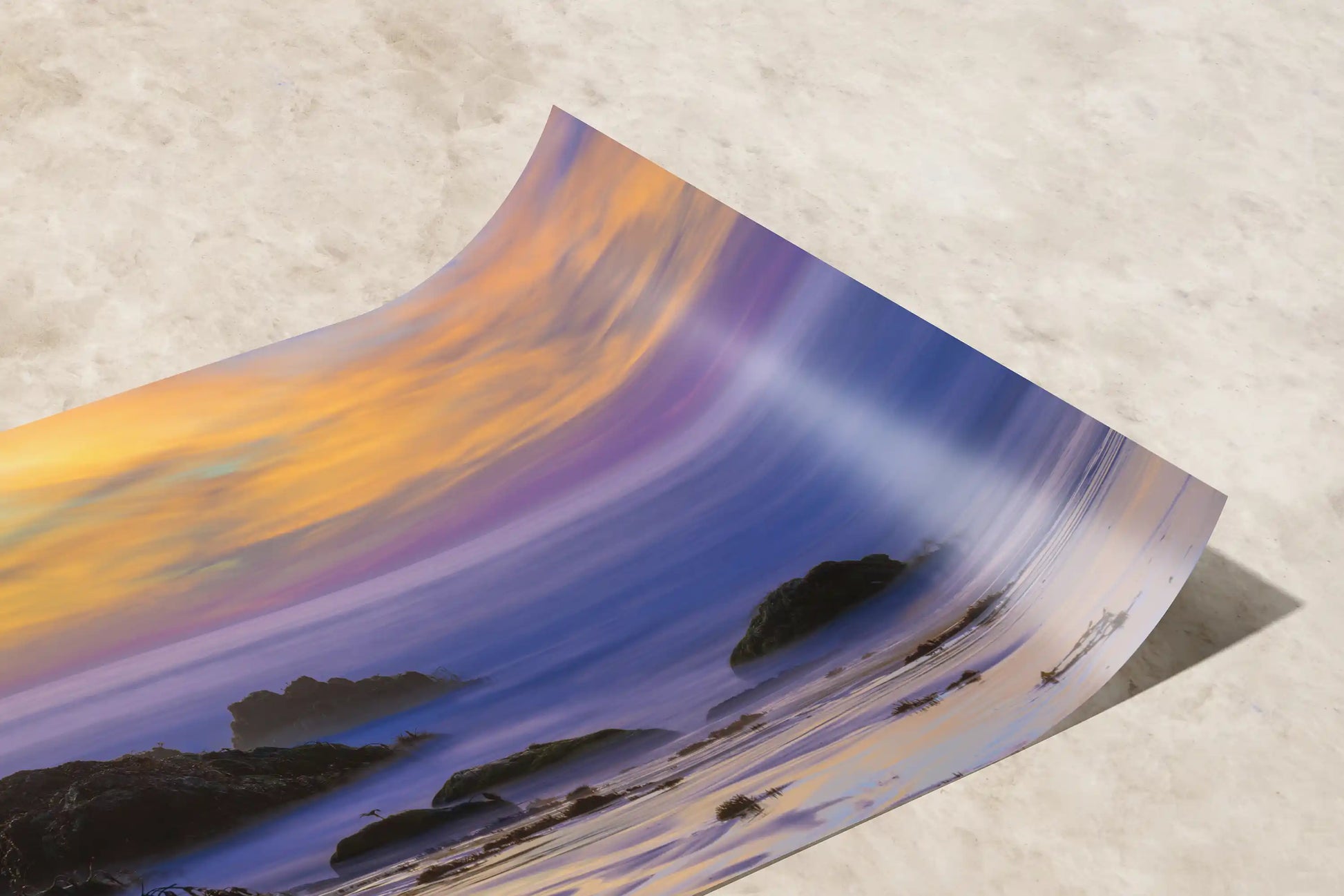 Close-up of a paper print showing the delicate gradation of sunset colors at Purple Sand Beach in Big Sur, detailing the art's exquisite quality.