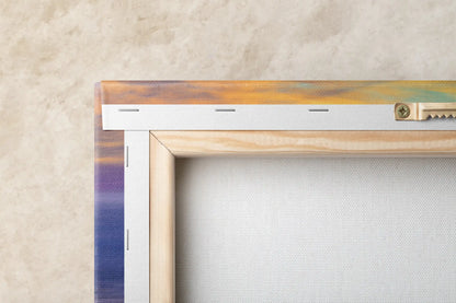 Back view of canvas art showcasing sturdy framing and mounting, with a glimpse of Purple Sand Beach's sunset colors on the side.