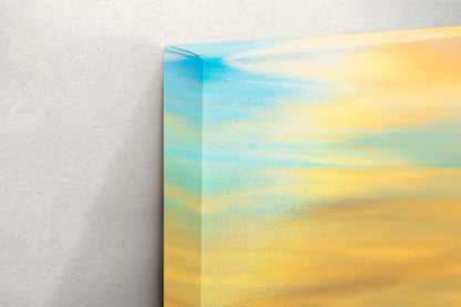 Close-up of canvas edge with a gradient of sunset colors over Purple Sand Beach, Big Sur, highlighting the quality wrap of the artwork.