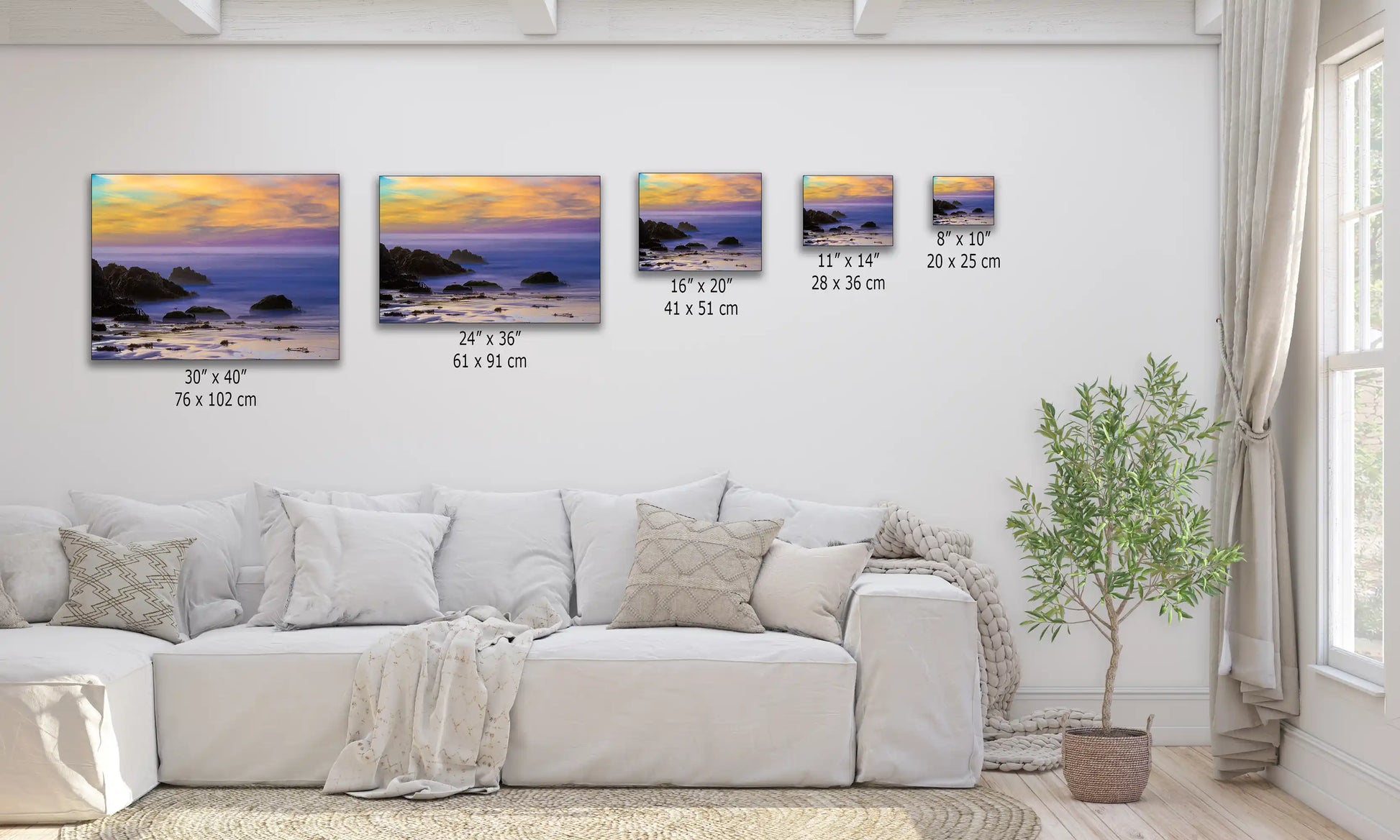 Wall art display above a sofa, depicting Purple Sand Beach at sunset in Big Sur, with rich purples and oranges enhancing a tranquil living space.