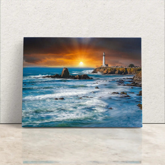 Canvas wall art depicting Pigeon Point Lighthouse at sunset, with rays shining over tumultuous blue waves.
