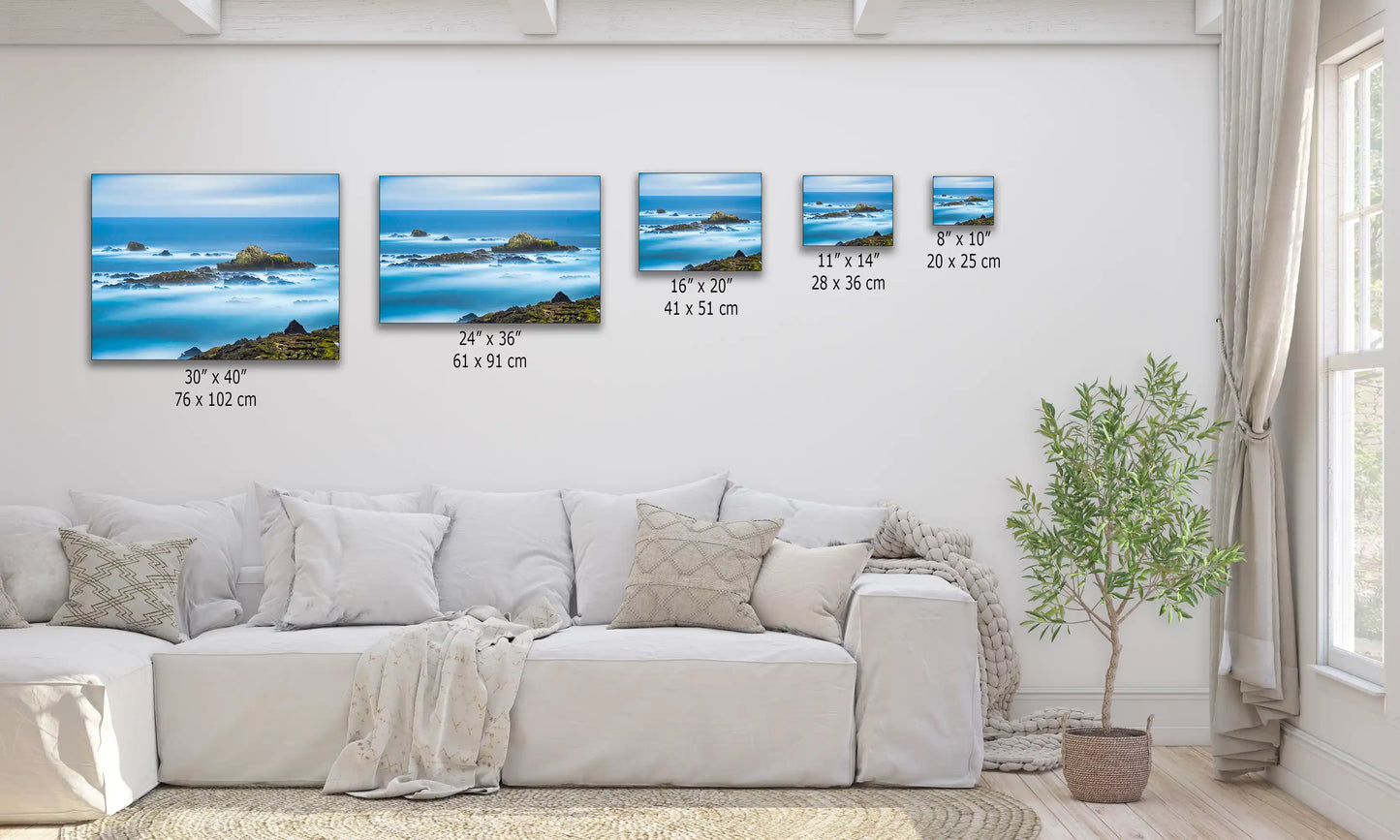 Various sized canvas prints of Point Lobos seascape displayed above a sofa, offering diverse oceanic wall art options.