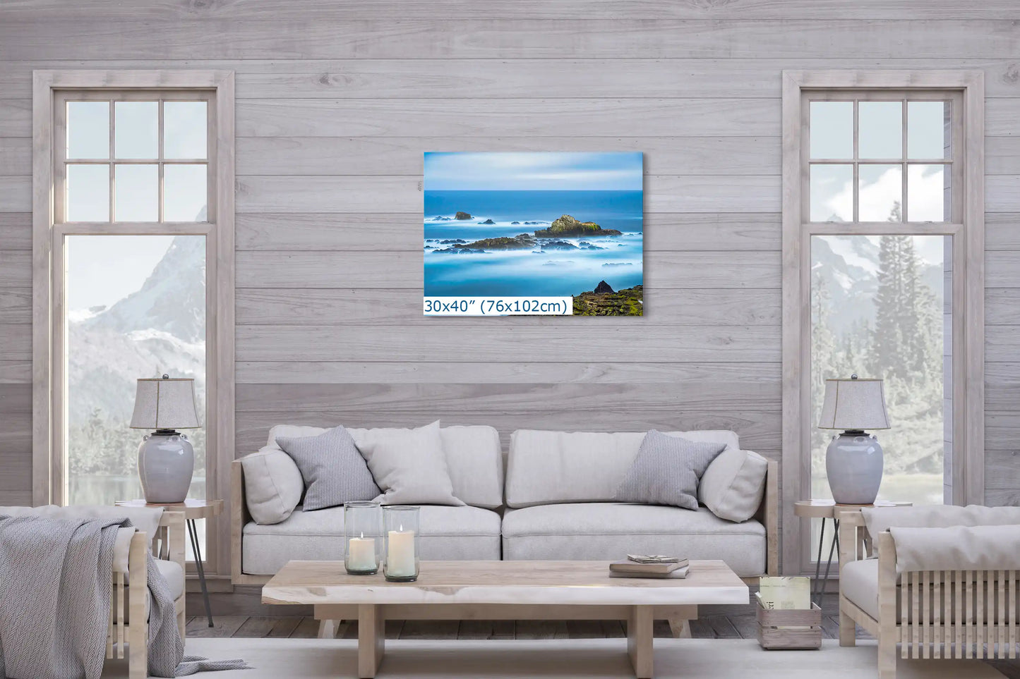Large 30"x40" canvas of Point Lobos ocean scene centers over a sofa, anchoring the living space with coastal serenity.