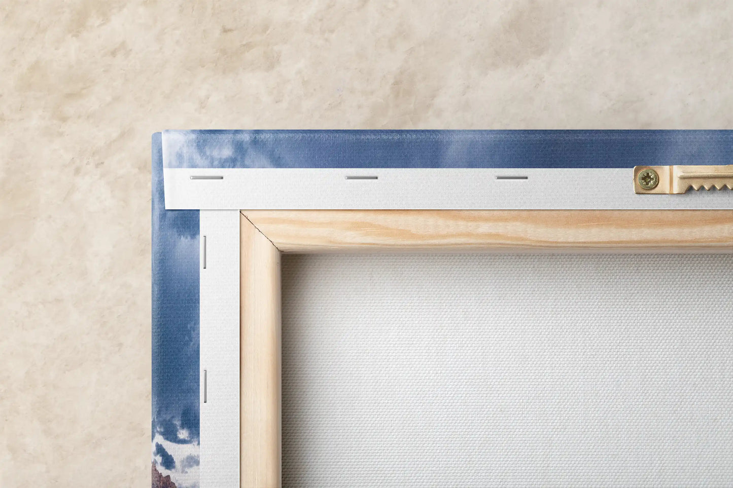 A close-up of the back frame and mounting hardware of a Red Rock Canyon canvas print, showing the canvas's stretched and secured backside.