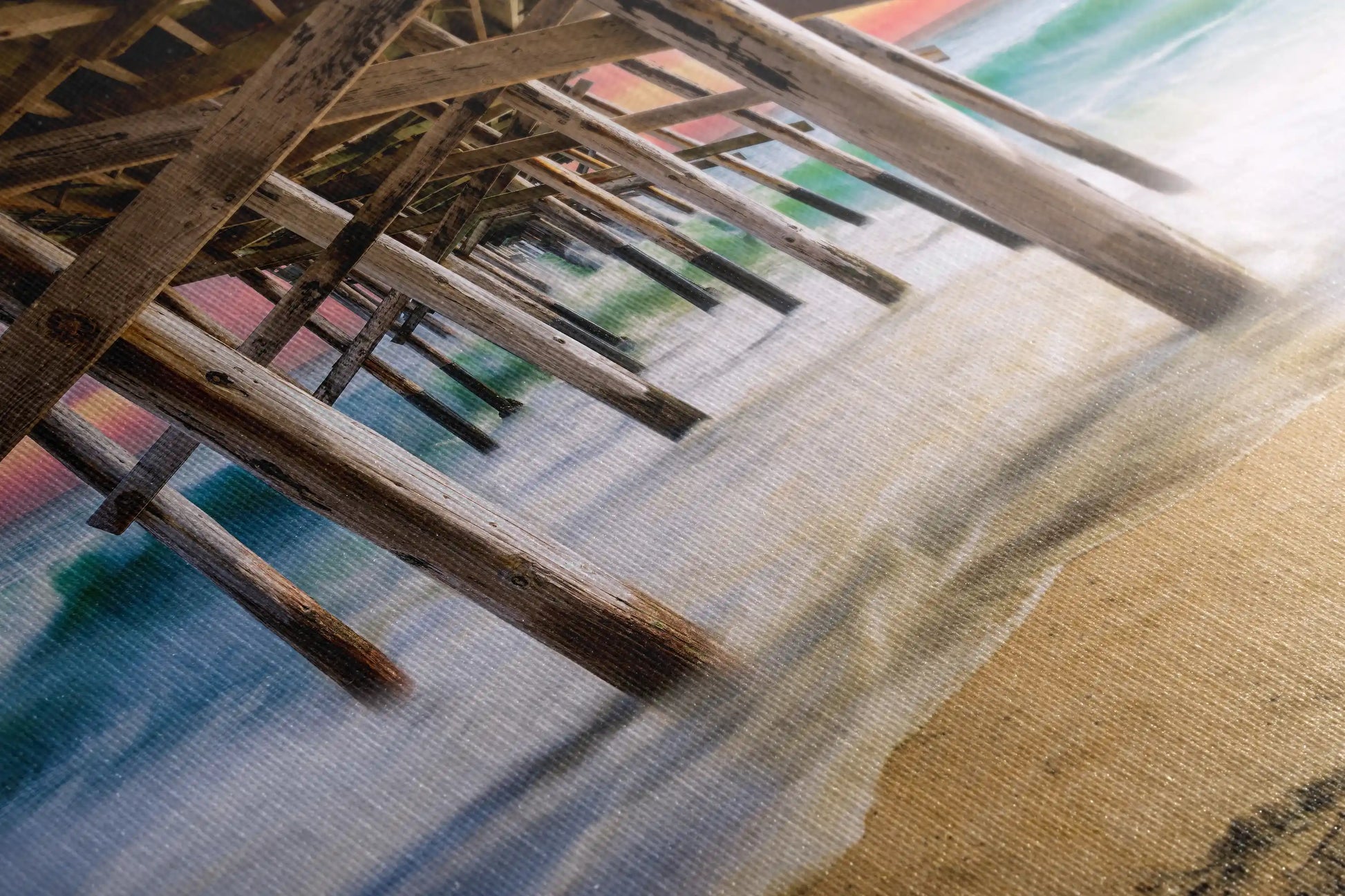 Detailed shot of canvas texture with a part of the image showing Under Balboa Pier at sunset, focusing on the wooden structure and water reflection.