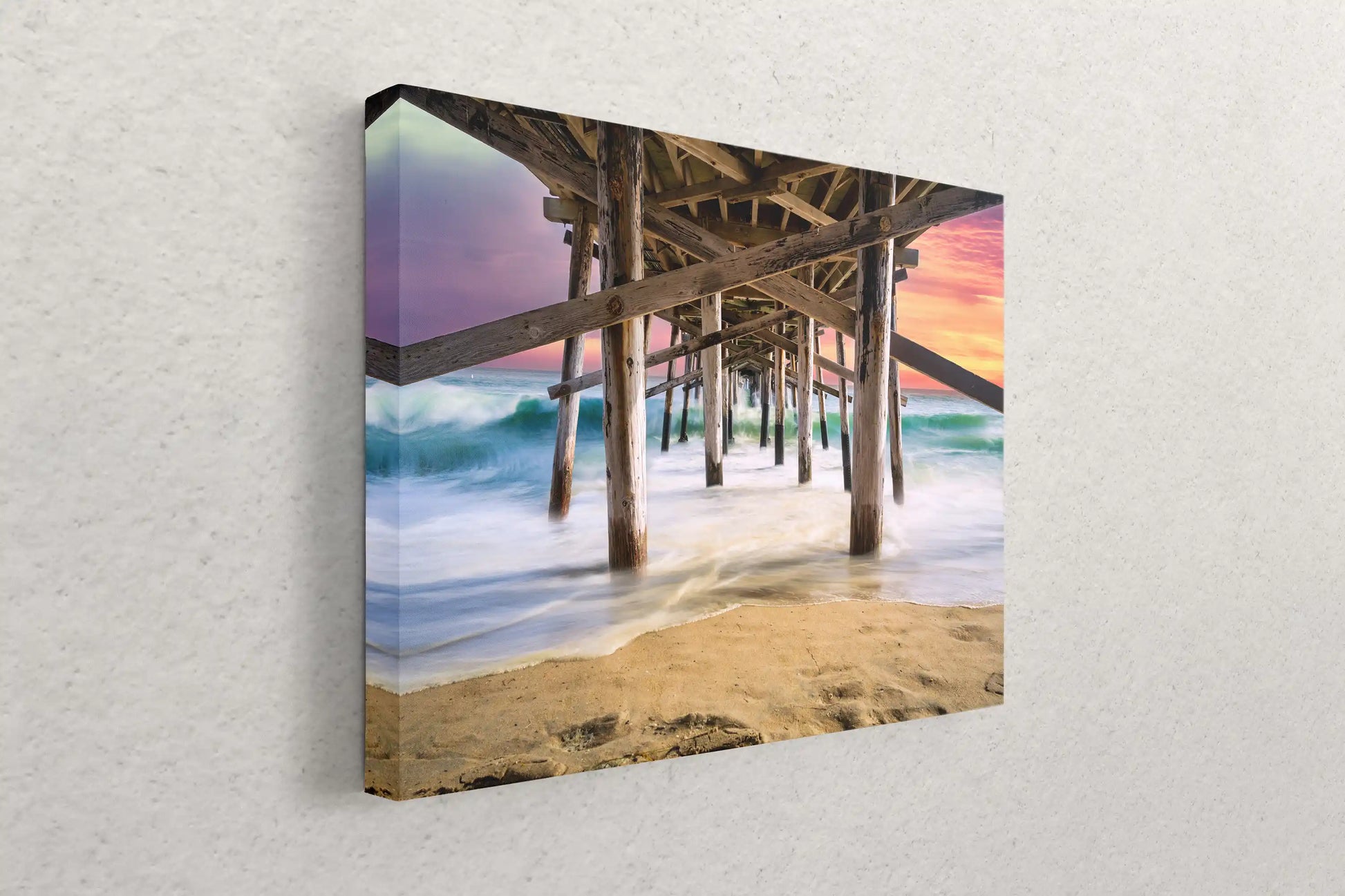 Angled side view of canvas wall art displaying the Balboa Pier at sunset, emphasizing the depth and detailed print quality.