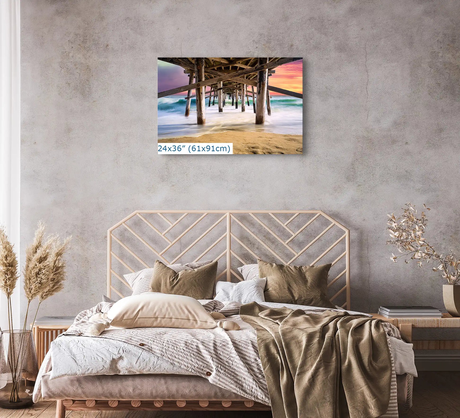 Large canvas wall art in 24x36-inches above a bed, featuring the Balboa Pier at sunset, creating a calm and relaxing bedroom atmosphere.