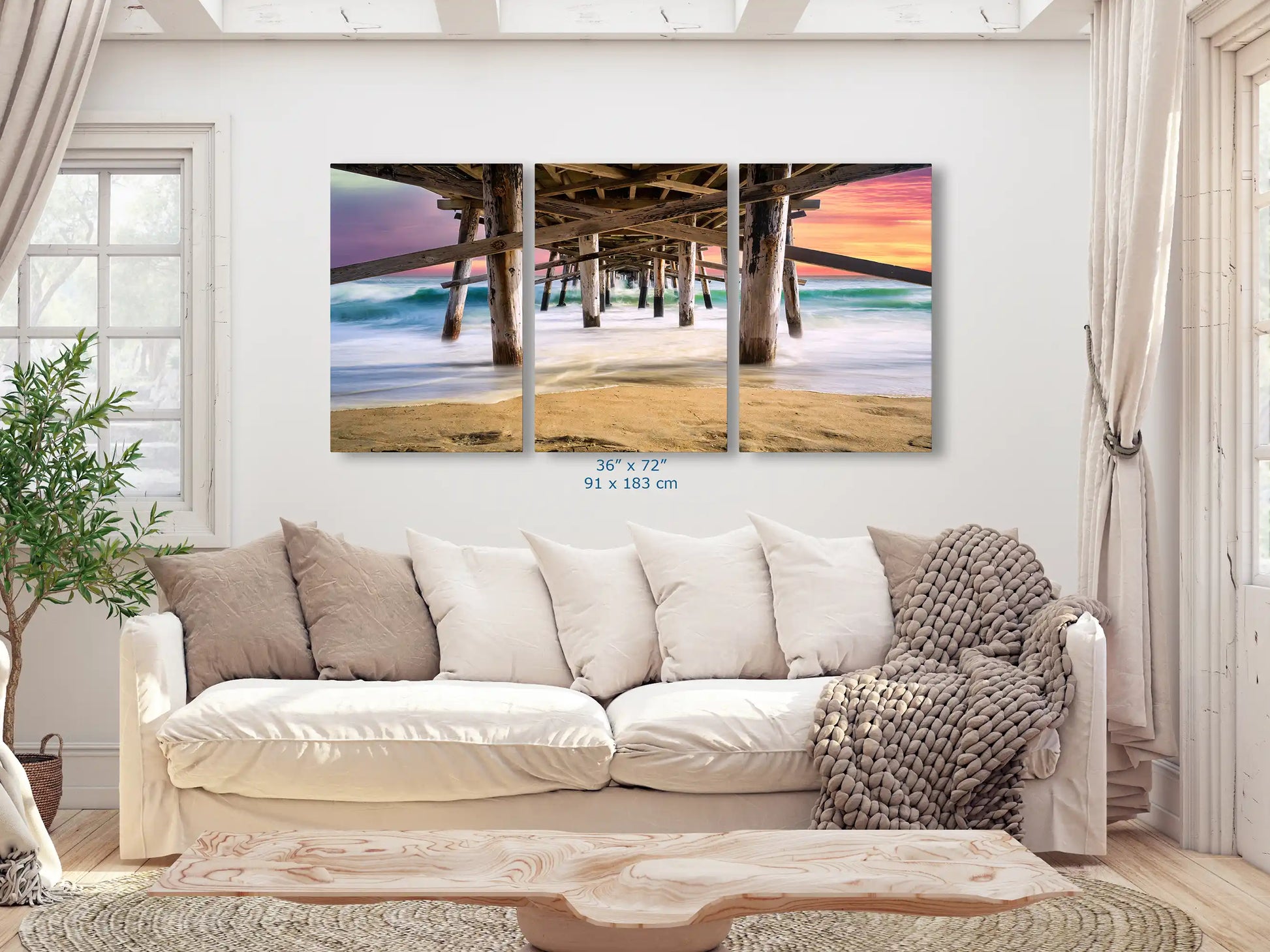 Expansive wall art of Balboa Pier at sunset in a living room, stretching 36x72, becoming the focal point of the space.