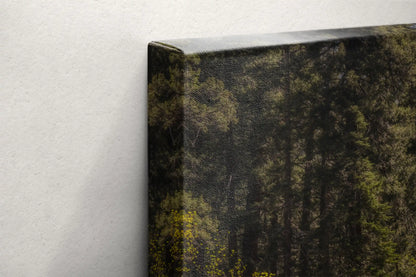 A close-up of the top left corner of a canvas print, showing the wrap and mounting hardware of the Vernal Falls artwork.