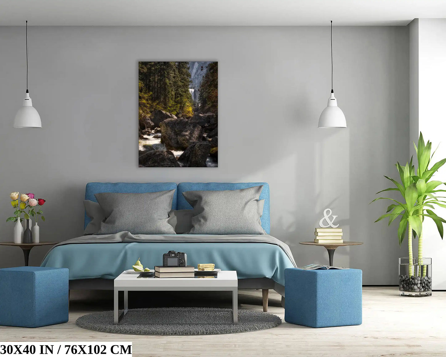 A 30x-40-inch print of Vernal Falls in Yosemite on a bedroom wall, complementing the blue bedspread and room decor.