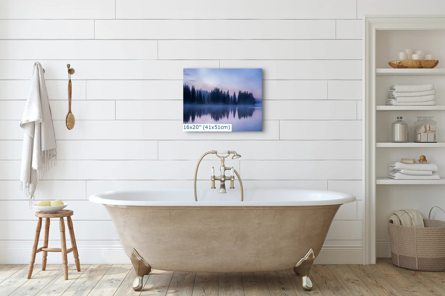 A 16x20 wall art print of Yellowstone Lake reflection at twilight, hung above a classic bathtub, enhancing the bathroom's serene ambiance.