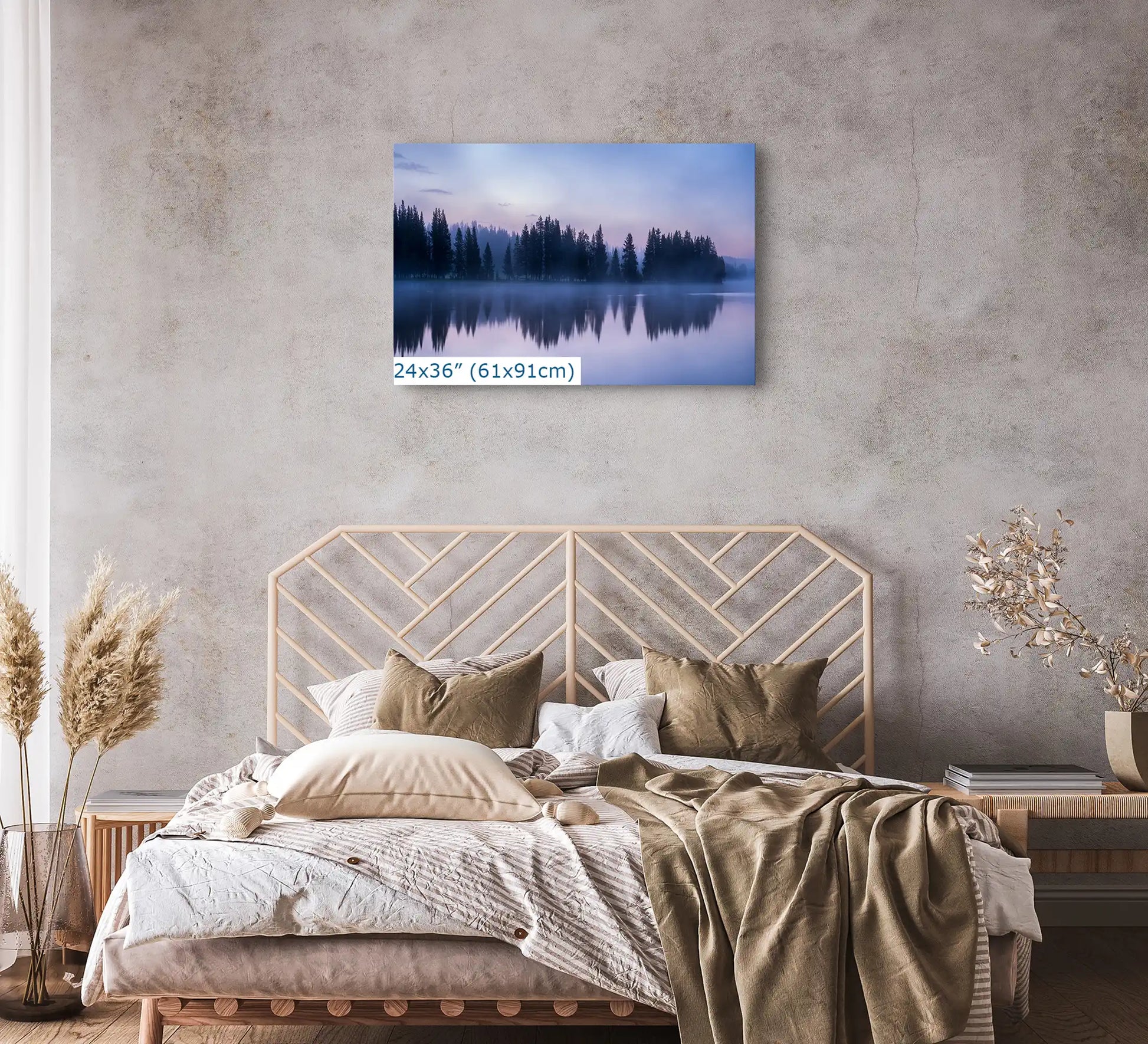 A 24x36 wall art print of Yellowstone Lake reflection at twilight above a bed, creating a peaceful bedroom retreat with its calming reflection.