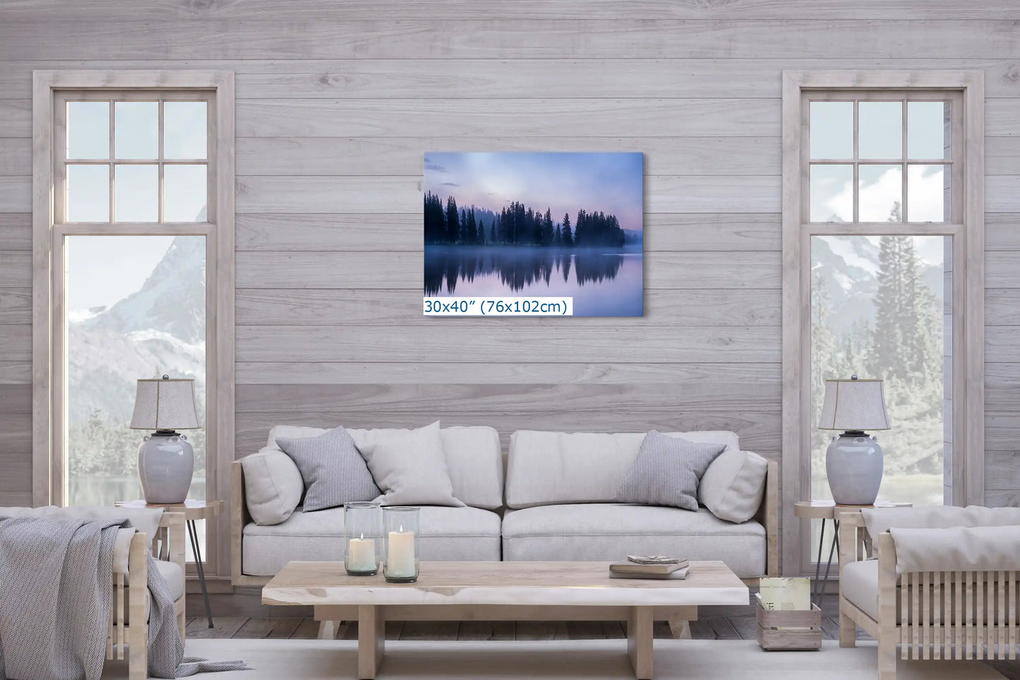 Large 30x40 wall art print of a tranquil twilight reflection scene at Yellowstone Lake, centered over a sofa, serving as a living room's focal point.
