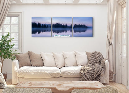 Three-panel wall art of 24x72, displaying a continuous twilight reflection on Yellowstone Lake, spanning across the living room wall.