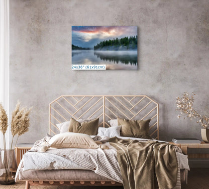 Large 24x36 canvas print of Yellowstone Lake's sunrise reflection, enhancing the calm of a cozy bedroom.