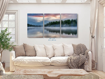 Massive 36x72 triptych panoramic canvas of Yellowstone Lake's tranquil sunrise, dominating the living room wall space.