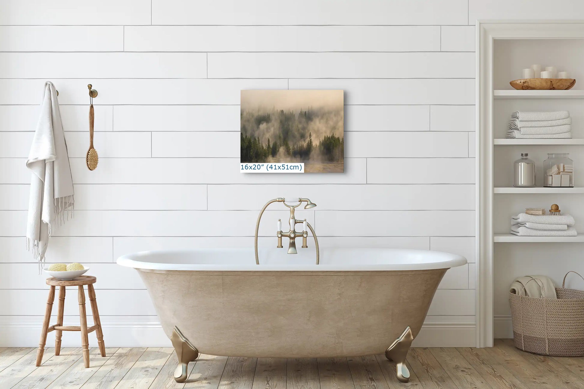 A 16x20 photo print of Yellowstone's foggy forest above a bathtub, blending nature's tranquility with home relaxation.