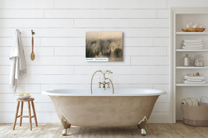 A 16x20 photo print of Yellowstone's foggy forest above a bathtub, blending nature's tranquility with home relaxation.