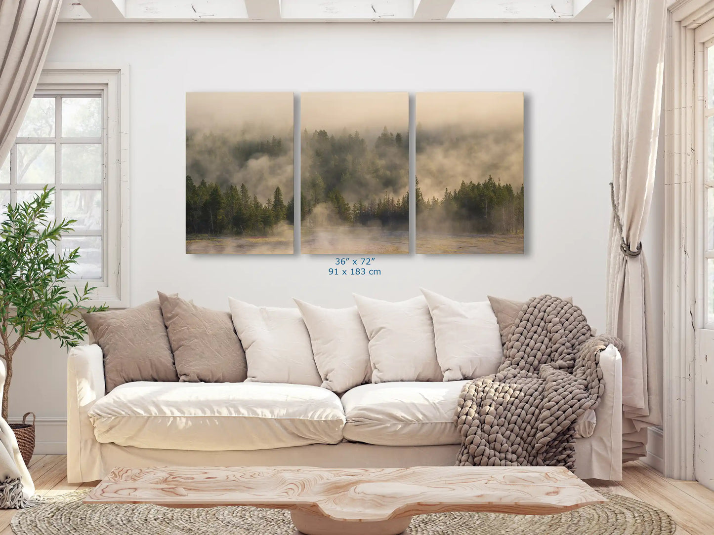 Large triptych canvas prints, 36x72 each, of Yellowstone's misty forest, spanning the length of a living room wall for a dramatic effect.