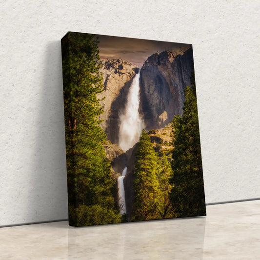 Wall art canvas print depicting Yosemite Falls at sunset with detailed textures and colors, perfect for adding a dramatic natural element to any interior design.