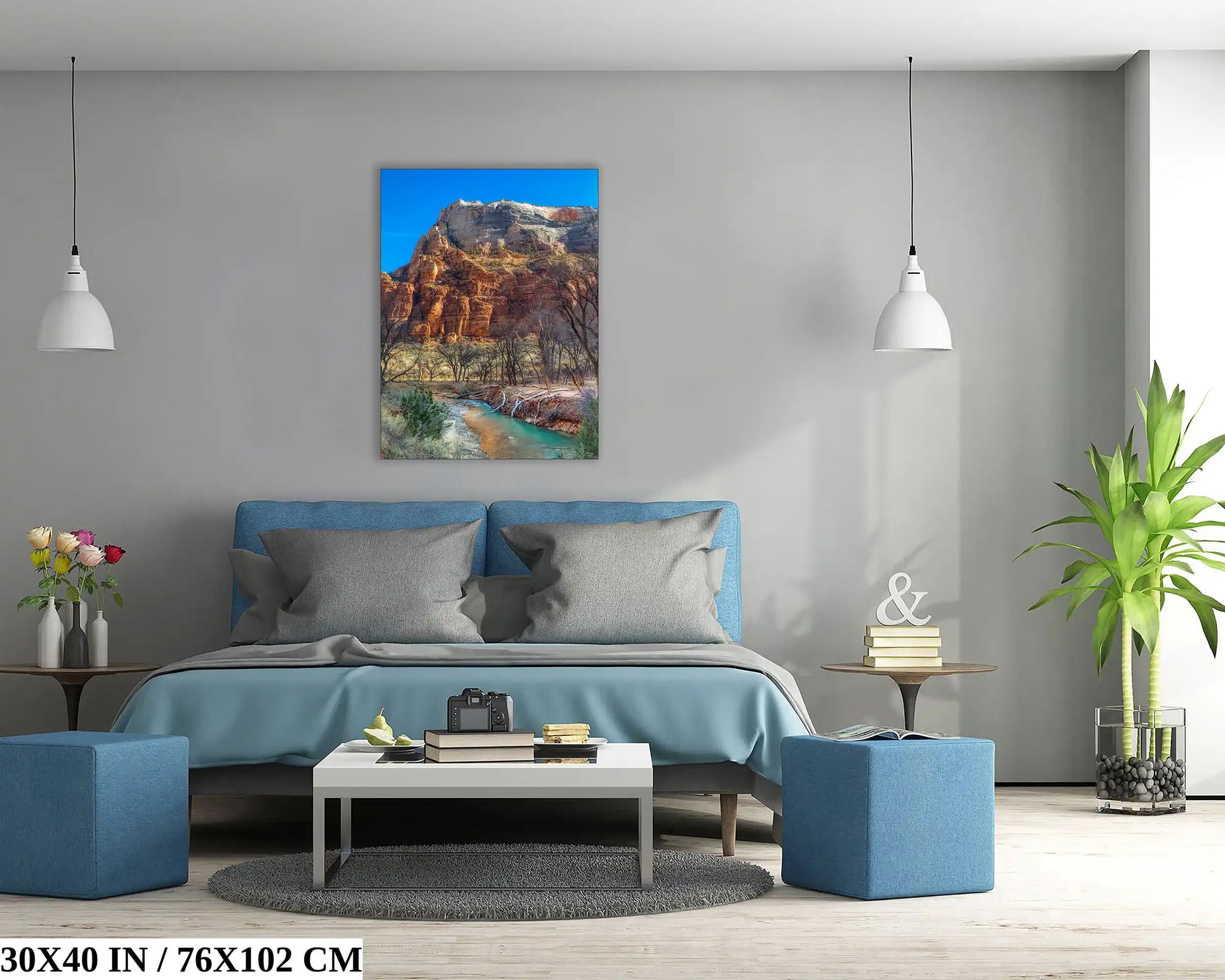 A 30x40 inch canvas print of Zion Mountain's stunning cliffs and river creates a focal point in a modern bedroom.