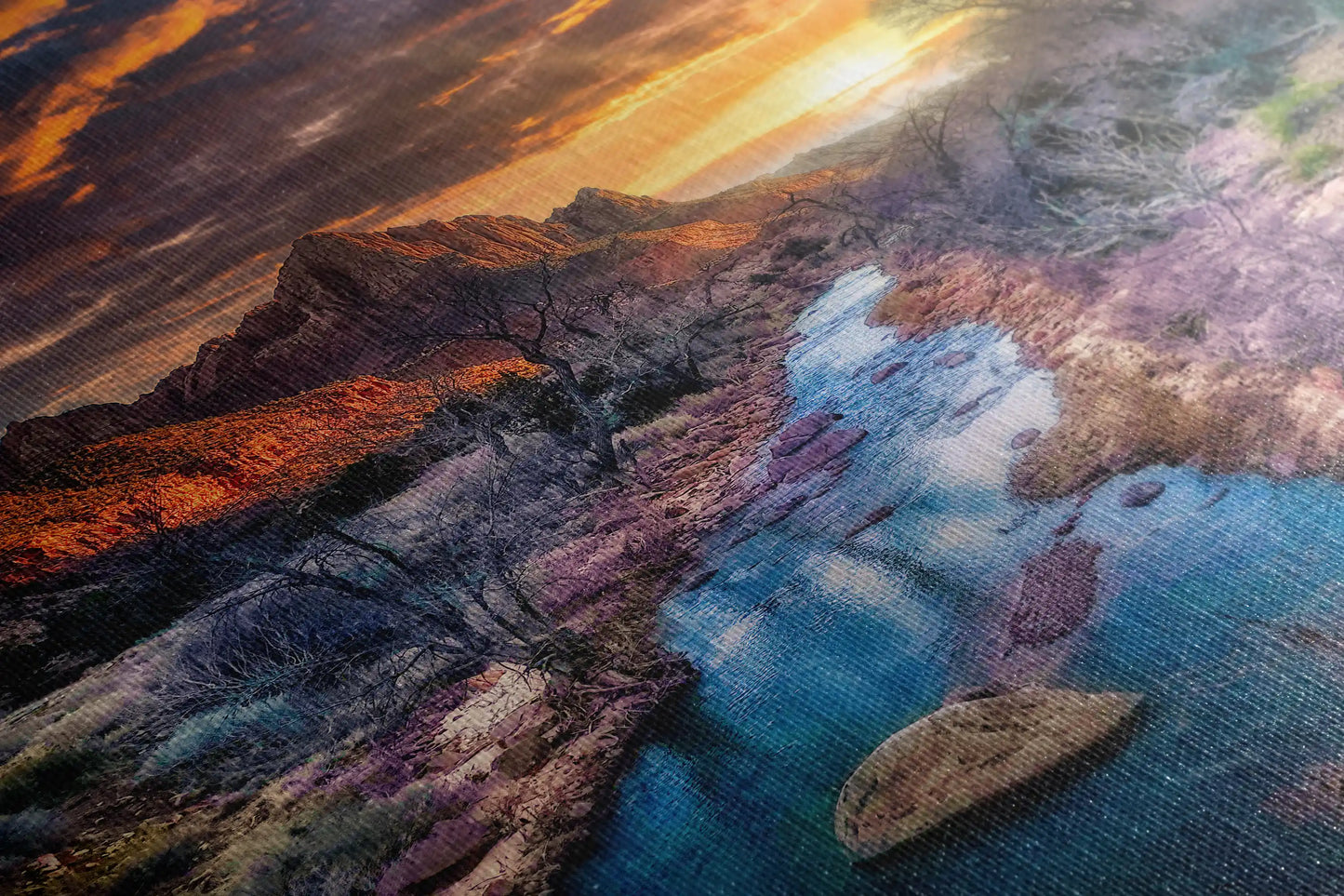 Close-up of a canvas print showing detailed texture of Zion's Watchman Mountain at sunset with vibrant colors and sharp contrasts.