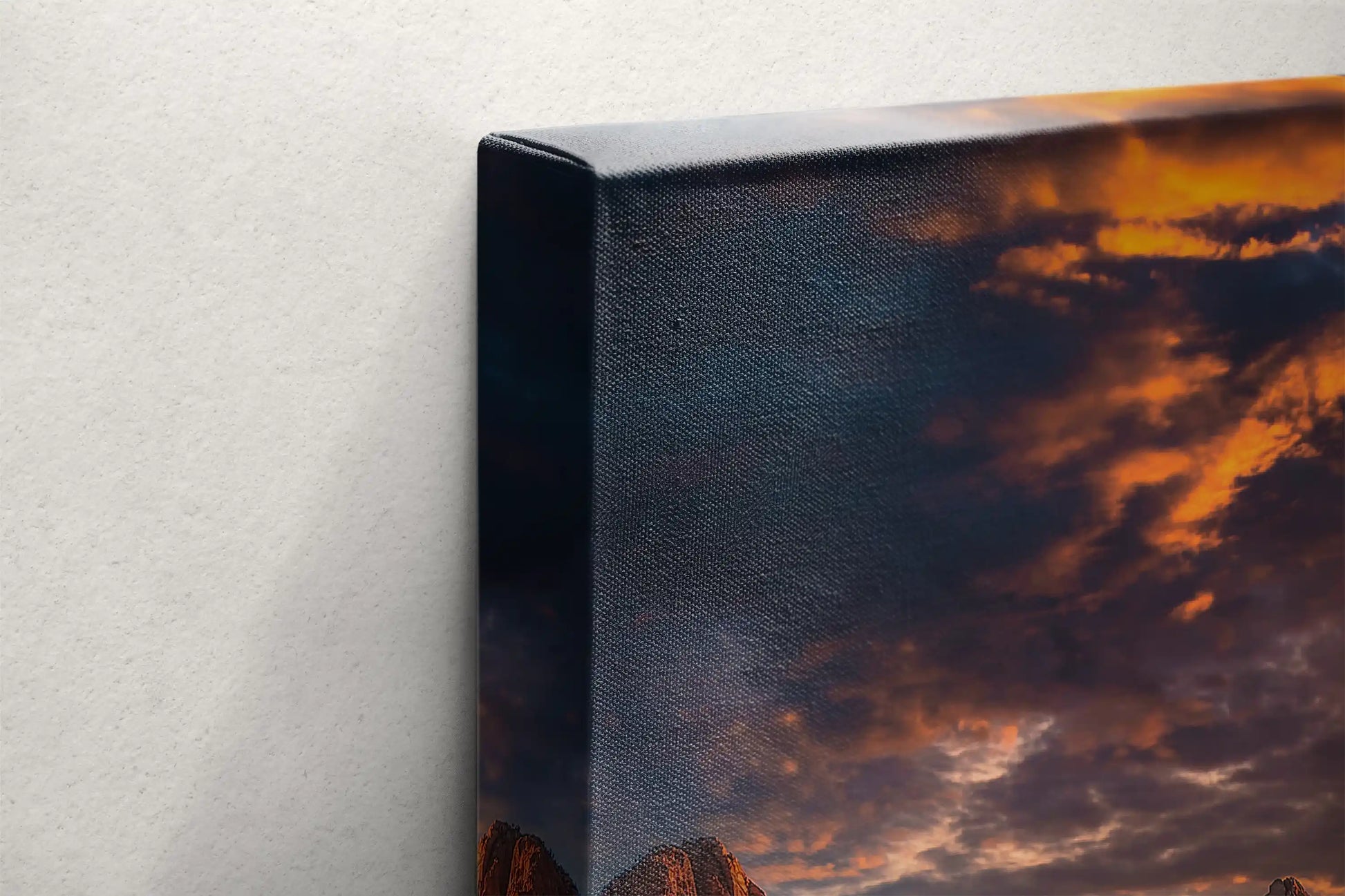 Corner view of a canvas wall art of Zion's Watchman Mountain sunset highlighting the thickness and the gallery-wrapping technique.