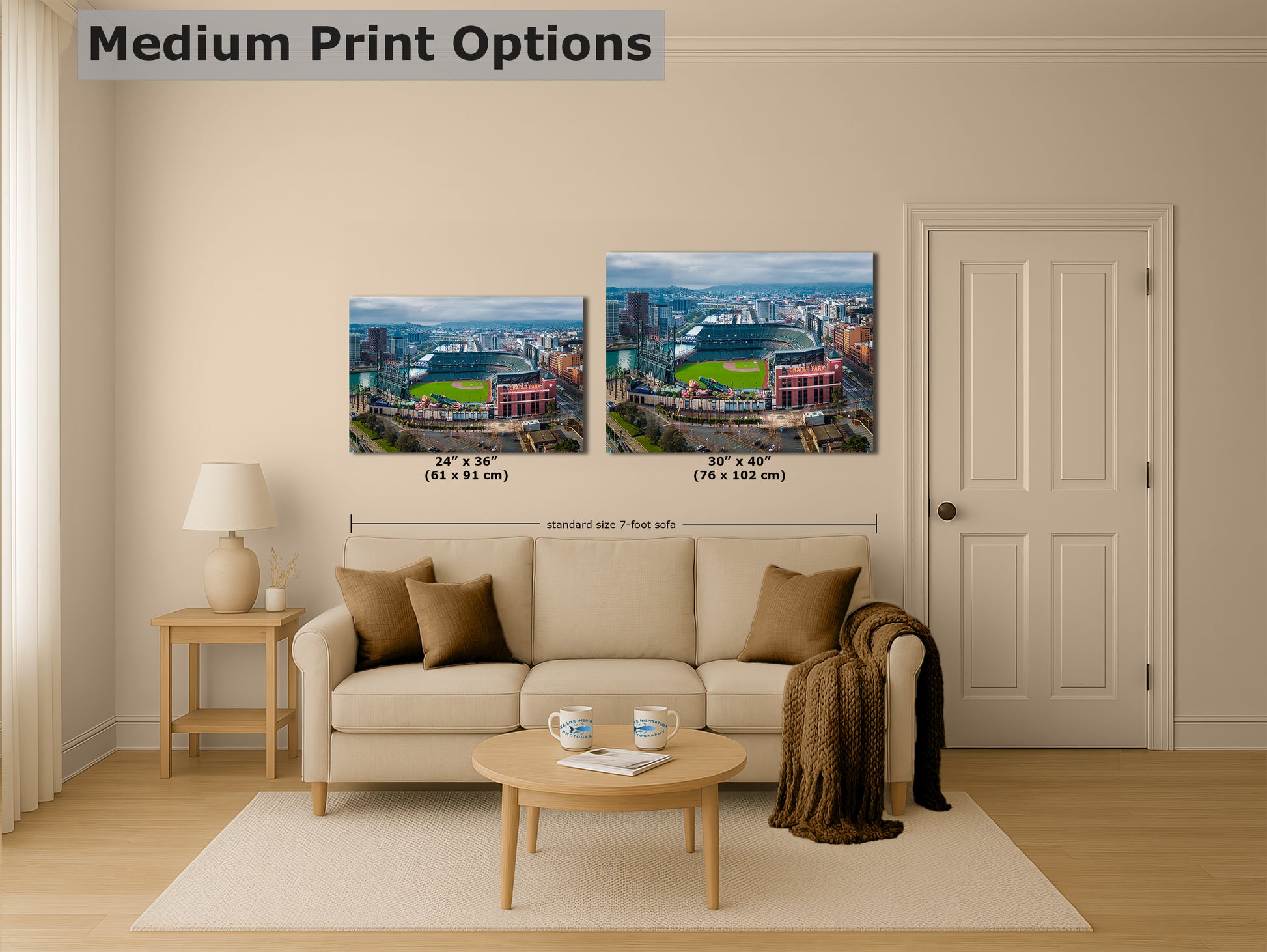 a living room with a beige sofa, a coffee table, and a lamp. There are two framed prints of a cityscape displayed on the wall above the sofa. The prints are of different sizes, with one being larger than the other. The text "MEDIUM PRINT OPTIONS" is visible, indicating that the image is a medium print option.