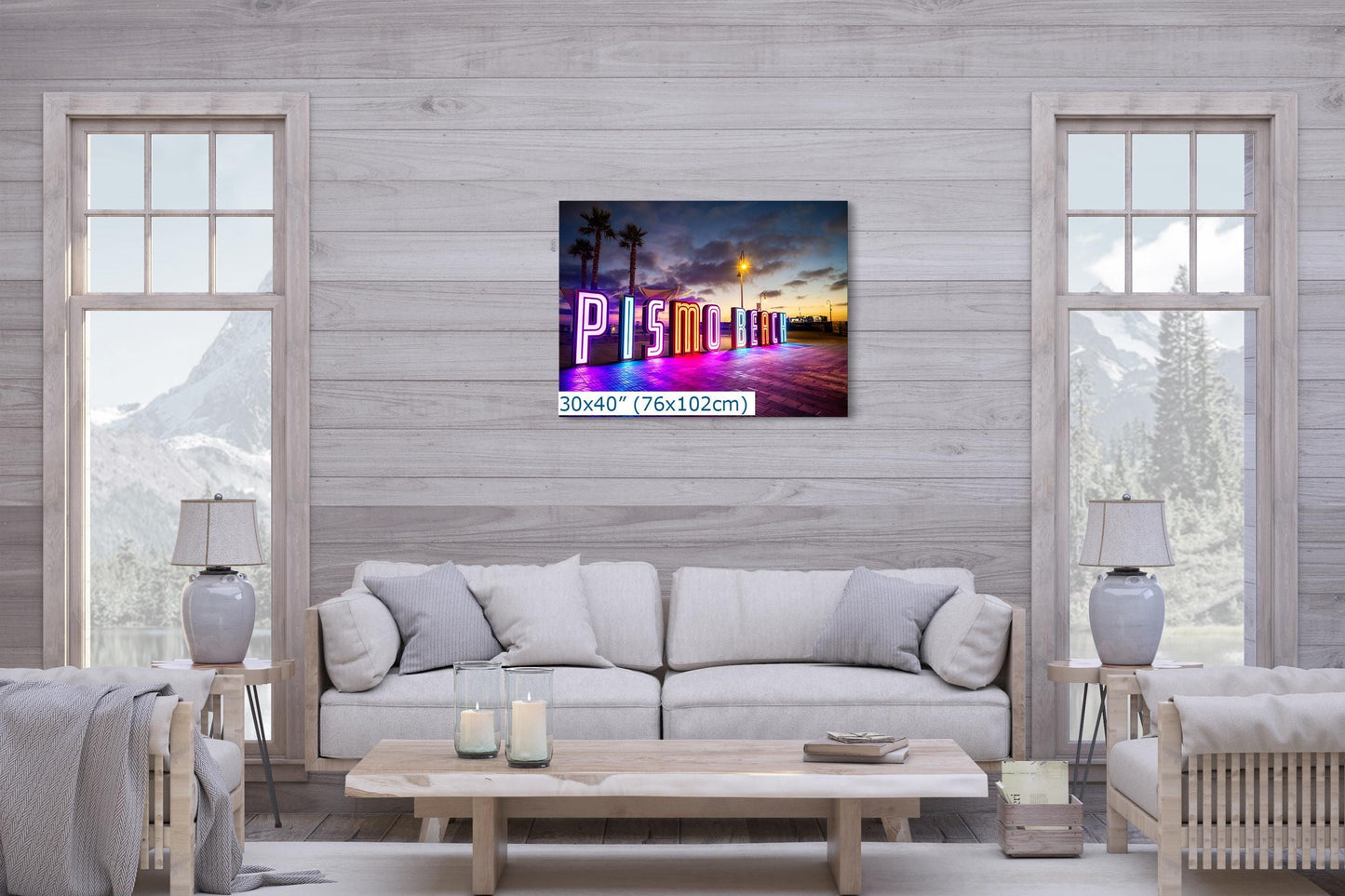 A 30x40 canvas print of the Pismo Beach neon sign hanging in a cozy living room, surrounded by soft tones and natural lighting.