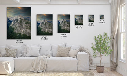 a living room with a white couch and paintings on the wall