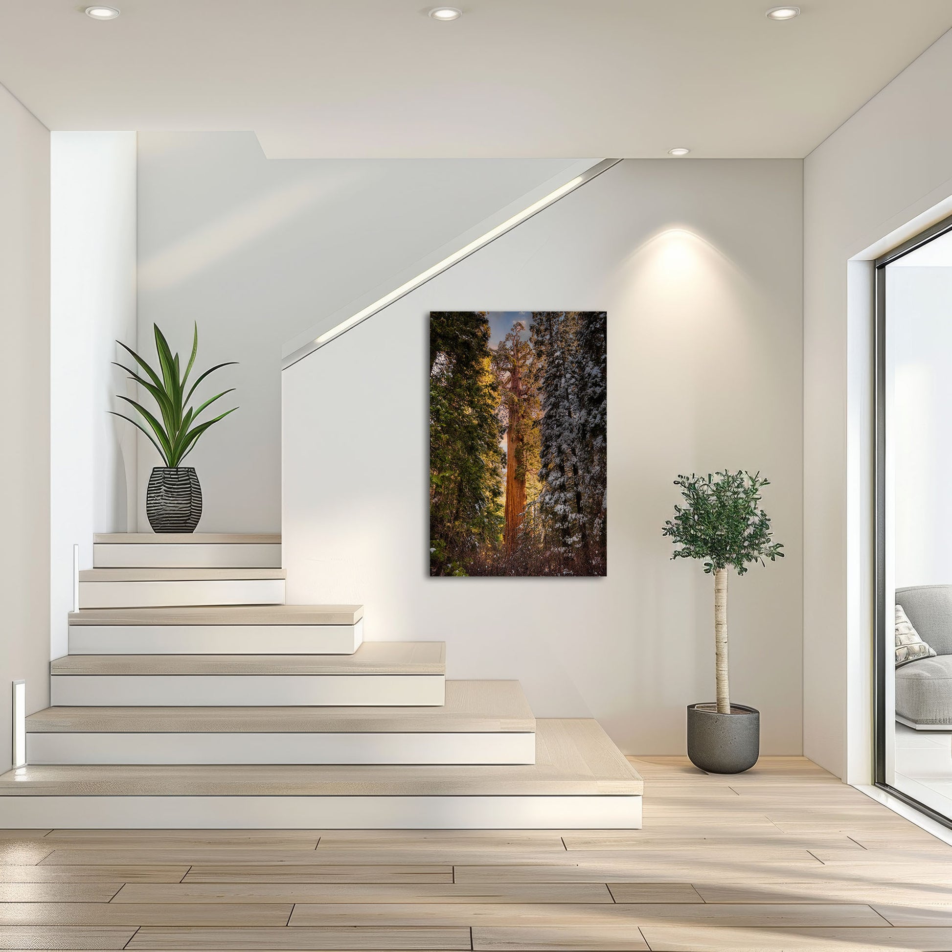 A canvas of the Giant Sequoia from Grant Grove adorns a bright stairwell, offering a lush green and earthy contrast to the modern, minimalist decor.