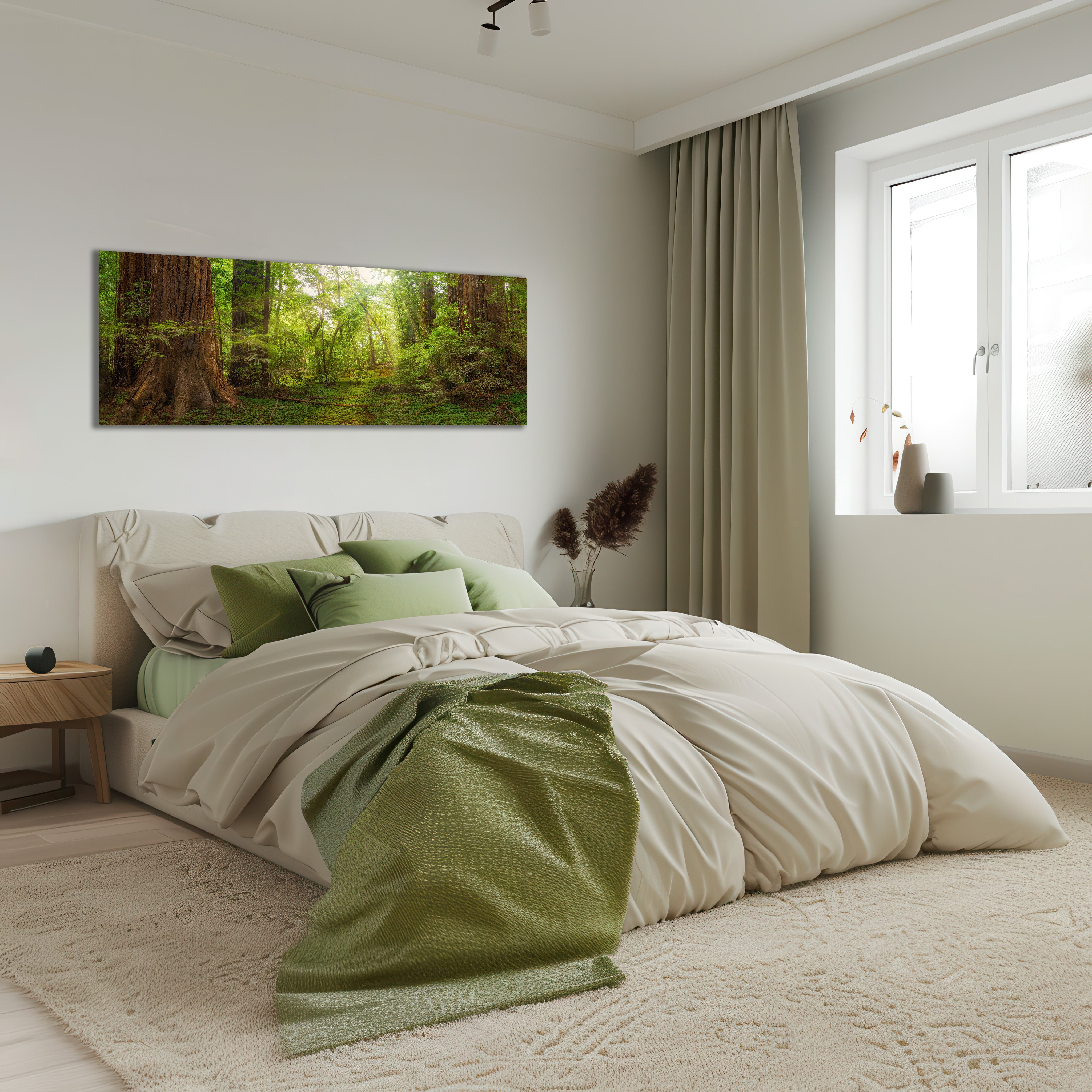 A modern bedroom featuring a wide rectangular wall art print of a lush green forest canopy hanging above a bed with neutral beige and green bedding. The room has a large cream rug, beige curtains, and a window on the right.